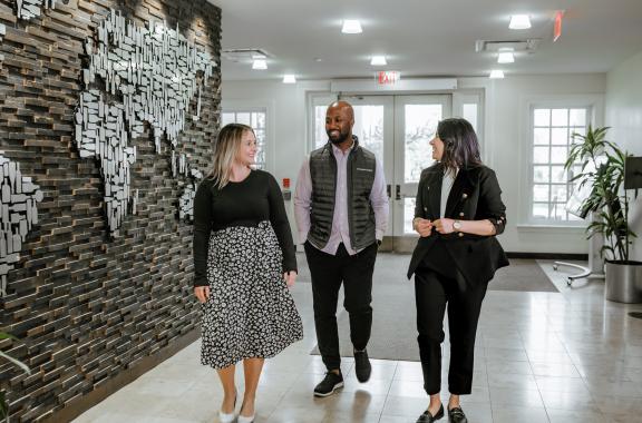 picture of Brown-Forman employees walking in a campus building