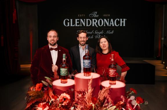 Employees standing behind The Glendronach displays