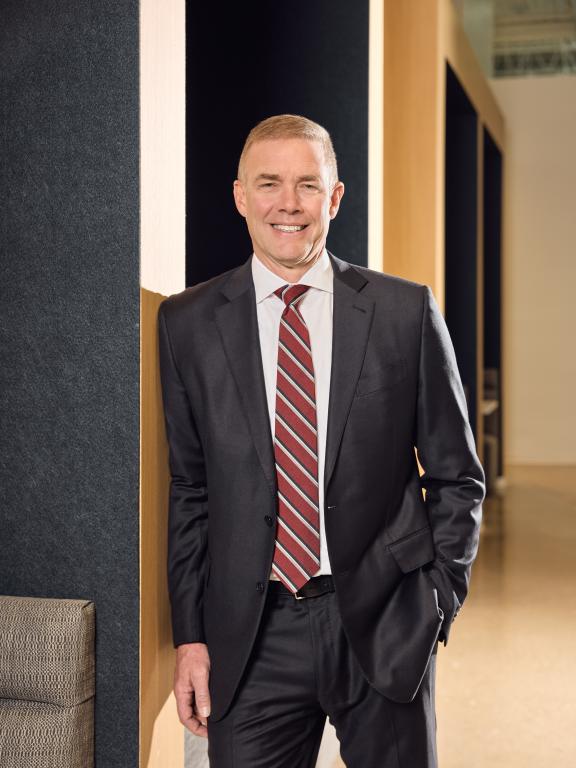 Jim Peters leaning against wall