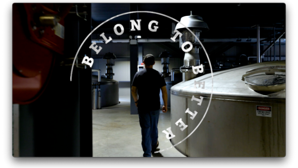 Employee walking away with Belong to Better in circular font