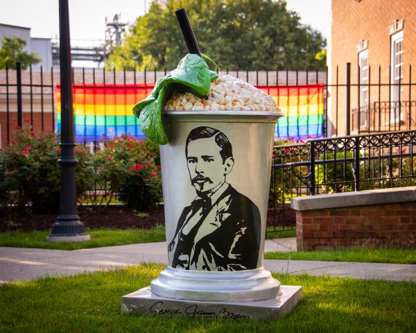 Mint Julep Statue with PRIDE Flag in Background